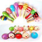 Maracas de madera con distintos diseños: rayas, flores, catarina y caritas