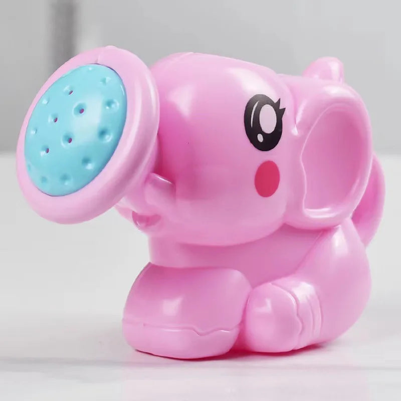 Regadera de elefante rosa con su ducha turquesa vista de cerca